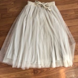 Tulle beige skirt.